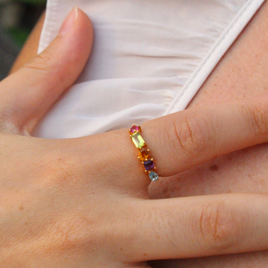 Colorful Gold Multi-Gemstone Ring with different shapes of swiss blue topaz, pink topaz, citrine, peridot, and purple amethyst