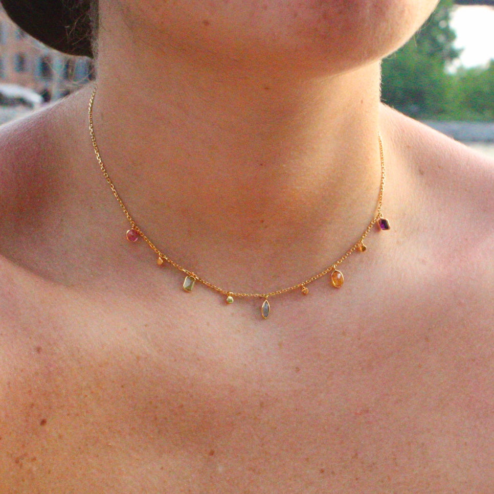 Colorful Gold Multi-Gemstone Drop Necklace with different shapes of swiss blue topaz, pink topaz, citrine, peridot, and purple amethyst